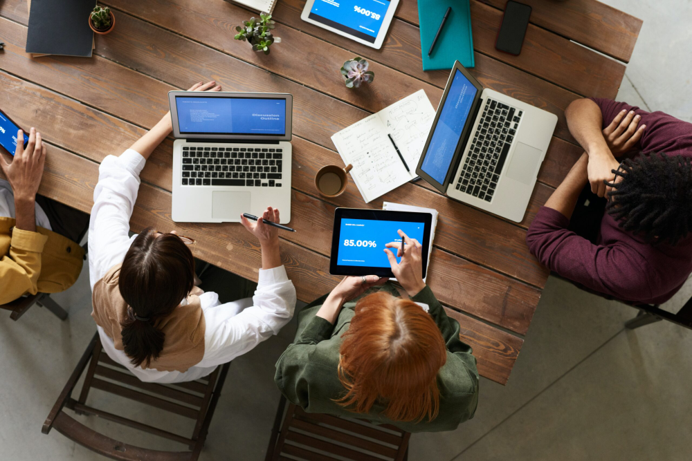 Group of people working on laptops